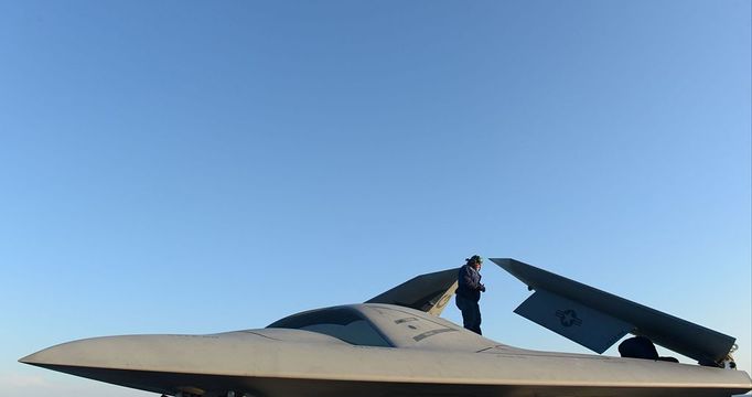 Unmanned X-47B prepares to be first catapult launch from a U.S. aircraft carrier Northrop Grumman personnel conduct pre-operational tests Tuesday, May 14, 2013 on an X-47B Unmanned Combat Air System (UCAS) demonstrator on the flight deck of the aircraft carrier USS George H.W. Bush (CVN 77). George H.W. Bush is scheduled to be the first aircraft carrier to catapult launch an unmanned aircraft from its flight deck.