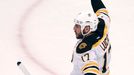 Boston Bruins' Milan Lucic celebrates after scoring on the Chicago Blackhawks during the first period in Game 1 of their NHL Stanley Cup Finals hockey game in Chicago, Il