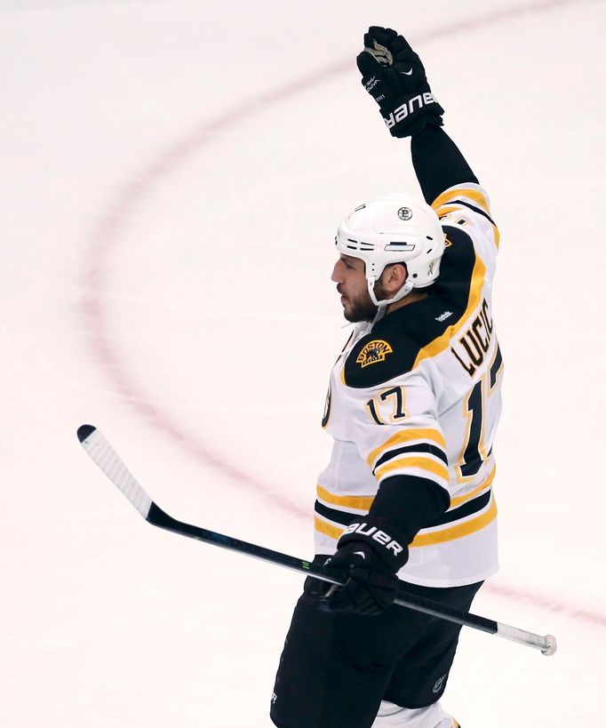 Boston Bruins' Milan Lucic celebrates after scoring on the Chicago Blackhawks during the first period in Game 1 of their NHL Stanley Cup Finals hockey game in Chicago, Il