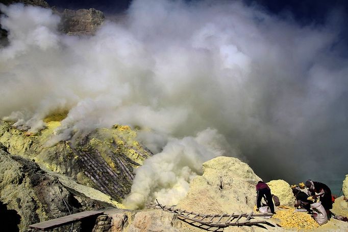 Sulfur miners risk health on Mount Ijen Jakarta, Indonesia. 24th October 2012 -- Sulfur mine with ladders, and gasses being released on Mt. Kawah Ijen. -- On Mount Ijen i