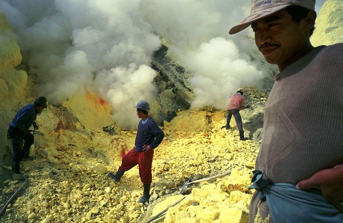 Mining Sulfur by Hand in Kawah Ijen Volcano Men working inside Kawah Ijen volcano, in East Java, Indonesia, one of the last places in the world where people mine sulfur b