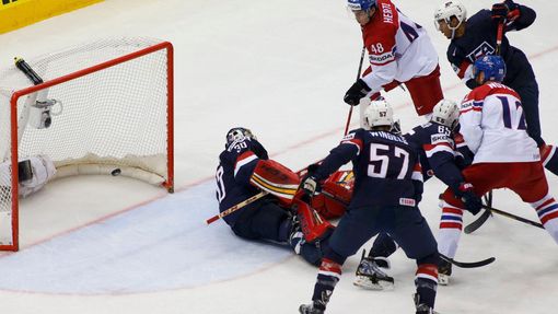 Tomas Hertl of the Czech Republic (top) against goalie Tim Thomas of the U.S. during their men's ice hockey World Championship quarter-final game at Chizhovka Arena in Mi
