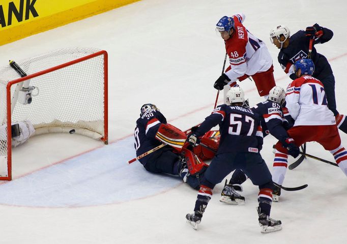 Tomas Hertl of the Czech Republic (top) against goalie Tim Thomas of the U.S. during their men's ice hockey World Championship quarter-final game at Chizhovka Arena in Mi