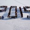 Students form &quot;2015&quot; standing on snow to welcome the upcoming New Year at Shenyang Agriculture University in Shenyang