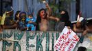 Indians and supporters of Indians point to a baby while shouting at military police, inside the Brazilian Indian Museum in Rio de Janeiro March 22, 2013. Brazilian military police took position early morning outside the Indian museum, where a native Indian community of around 30 individuals who have been living in the abandoned Indian Museum since 2006. Indians were summoned to leave the museum in 72 hours by court officials since last week, local media reported. The group is fighting against the destruction of the museum, which is next to the Maracana Stadium. REUTERS/Pilar Olivares (BRAZIL - Tags: POLITICS MILITARY CIVIL UNREST) Published: Bře. 22, 2013, 11:49 dop.