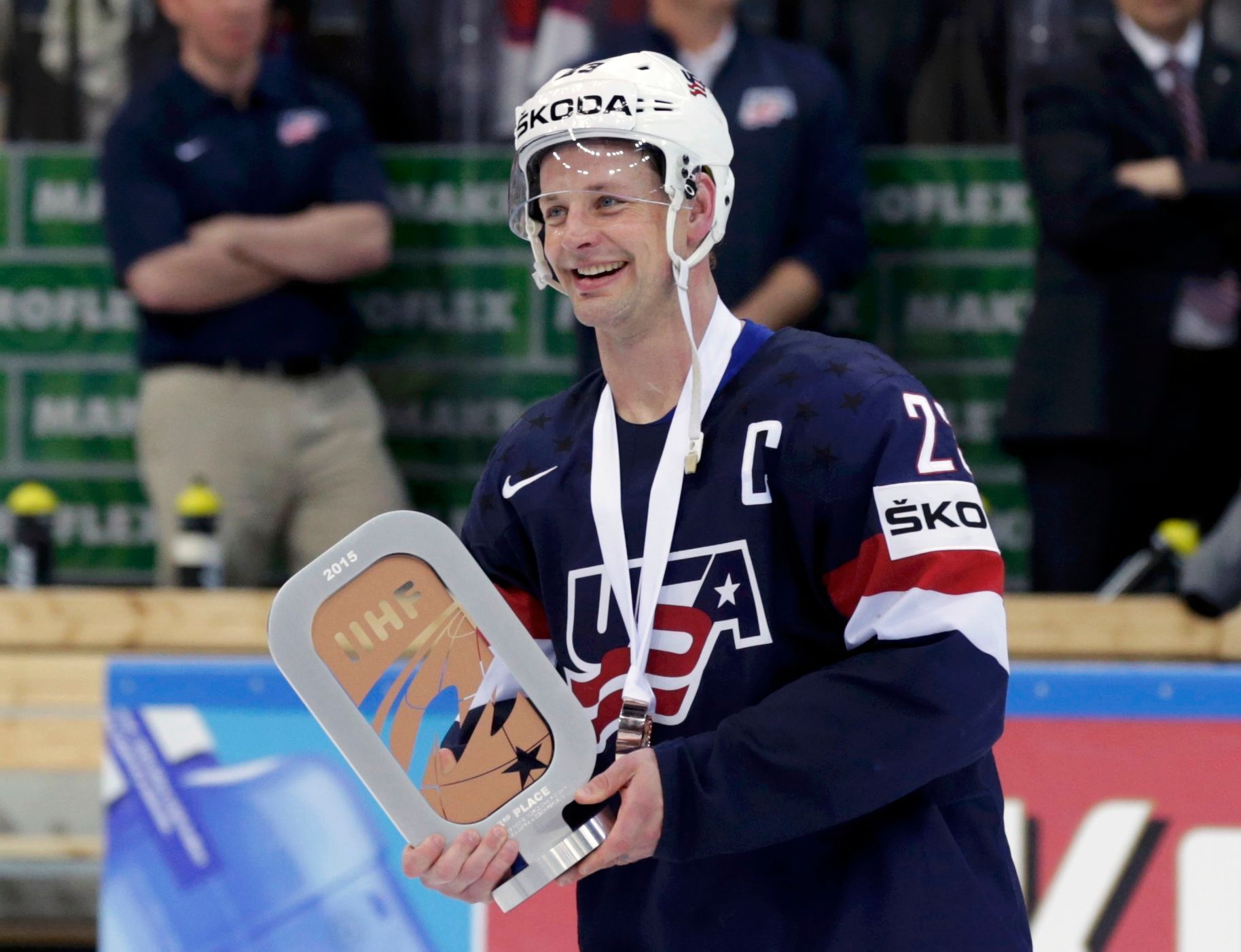 Hendricks of the U.S.holds the third place trophy after their Ice Hockey World Championship third-place game against the Czech Republic at the O2 arena in Prague