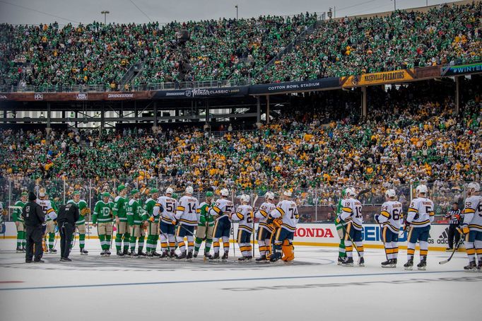 Jan 1, 2020; Dallas, Texas, USA; The Dallas Stars players shake hands with the Nashville Predators players after the 2020 Winter Classic hockey game at the Cotton Bowl in