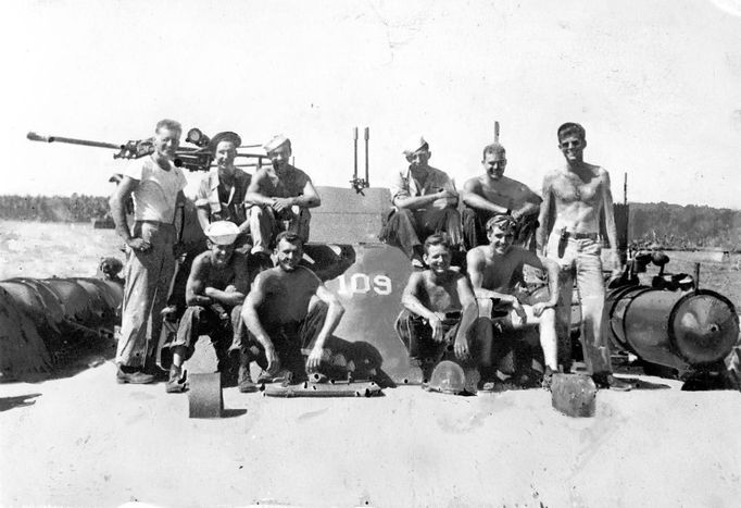 The crew of Patrol Torpedo boat PT-109, including U.S. Navy Lt. John F. Kennedy (R), are seen off Guadalcanal, in this handout image taken in July 1943.