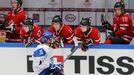 Finland's Teravainen celebrates in front of Canada's bench after scoring on a penalty s