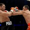 Ukrainian heavyweight boxing world champion Klitschko delivers a punch to his challenger Bulgarian Pulev during their title fight in Hamburg