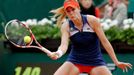 Alize Cornet of France returns a forehand to Taylor Townsend of the U.S. during their women's singles match at the French Open tennis tournament at the Roland Garros stad