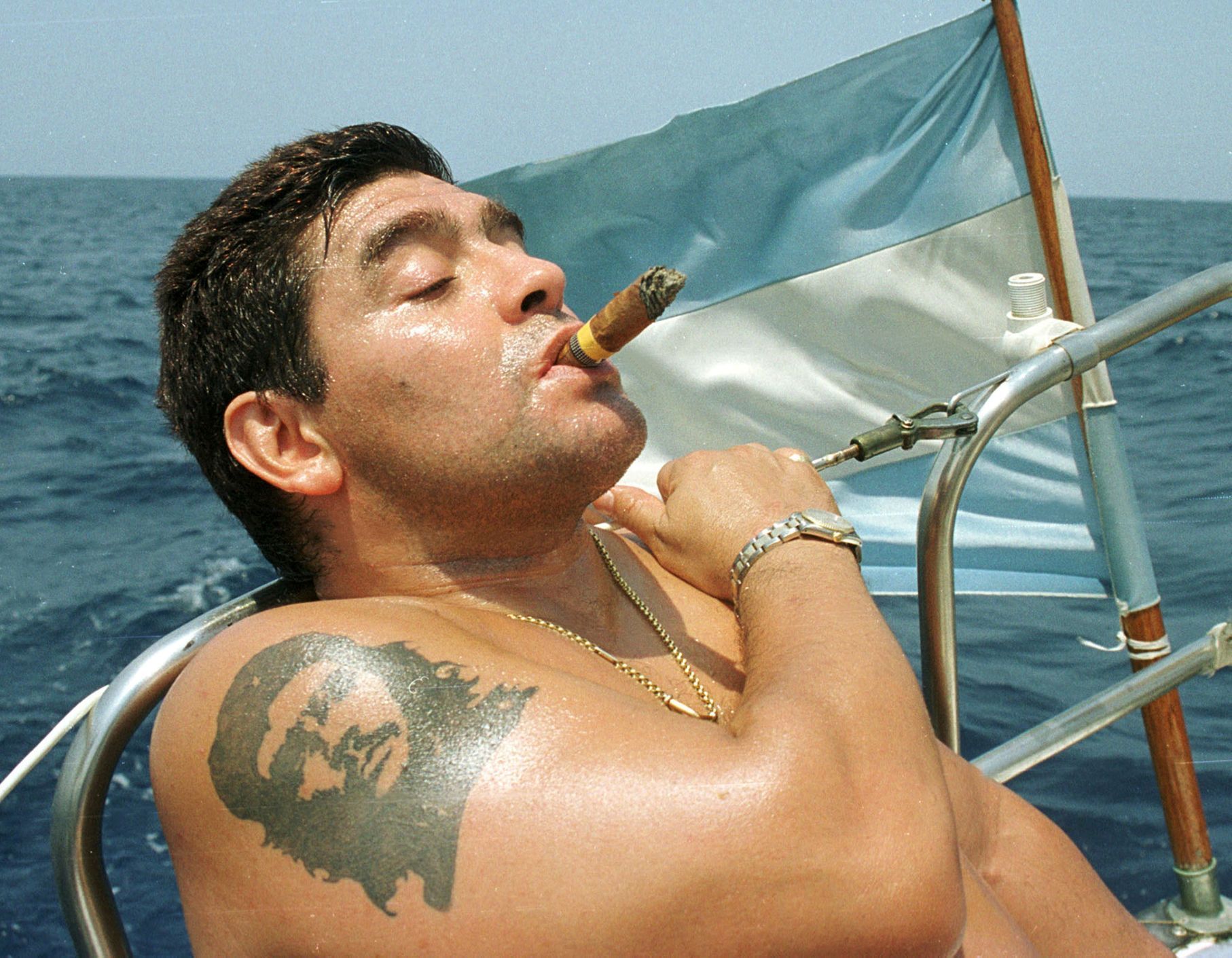 FILE PHOTO: Argentine World Cup winner Diego Maradona smokes a cigar in the waters off Havana, Cuba