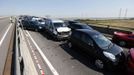 The wreckage of some of the 100 vehicles involved in multiple collisions, which took place in dense fog during the morning rush hour, fills the Sheppey Bridge in Kent, east of London, September 5, 2013. Eight people were seriously injured and dozens hurt in the multiple crashes.