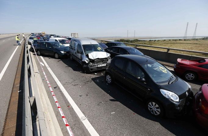 The wreckage of some of the 100 vehicles involved in multiple collisions, which took place in dense fog during the morning rush hour, fills the Sheppey Bridge in Kent, ea