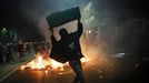 A demonstrator holds up a wastepaper bin during a protest against the 2014 World Cup, in Sao Paulo May, 15 2014. Road blocks and marches hit Brazilian cities on Thursday