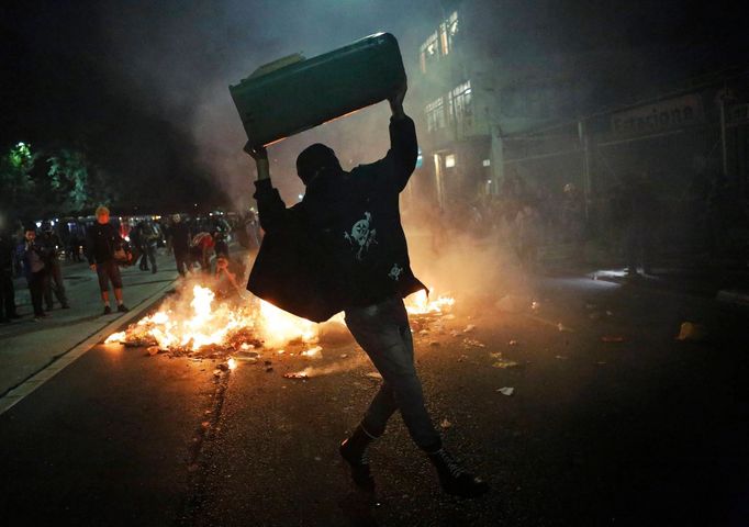 A demonstrator holds up a wastepaper bin during a protest against the 2014 World Cup, in Sao Paulo May, 15 2014. Road blocks and marches hit Brazilian cities on Thursday