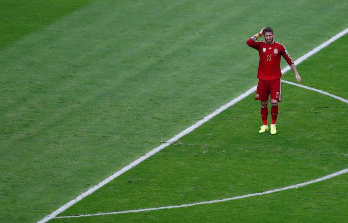 Spain's Sergio Ramos walks on the pitch during the 2014 World Cup Group B soccer match between Spain and Chile at the Maracana stadium in Rio de Janeiro June 18, 2014. RE