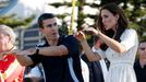 Catherine, Britain's Duchess of Cambridge, is instructed on a swimming stroke by former Australian surf lifesaving team member Allum at Sydney's Manly beach