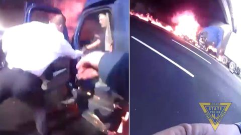 Muž uvízl v hořícím kamionu, dramatické záběry ukazují záchranu vteřiny před explozí