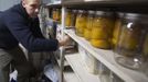 Hugh Vail inventories his food storage at his home in Bountiful, Utah, December 10, 2012. While most "preppers" discount the Mayan calendar prophecy, many are preparing to be self-sufficient for threats like nuclear war, natural disaster, famine and economic collapse. Picture taken December 10, 2012. REUTERS/Jim Urquhart (UNITED STATES - Tags: SOCIETY FOOD) Published: Pro. 18, 2012, 5:23 odp.