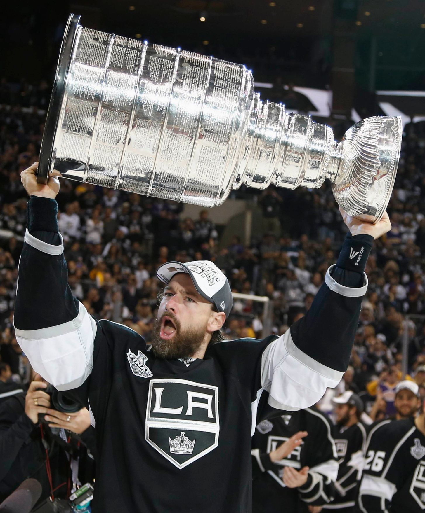 Los Angeles Kings' Justin Williams celebrates with the Stanley Cup after NHL Stanley Cup Finals in Los Angeles