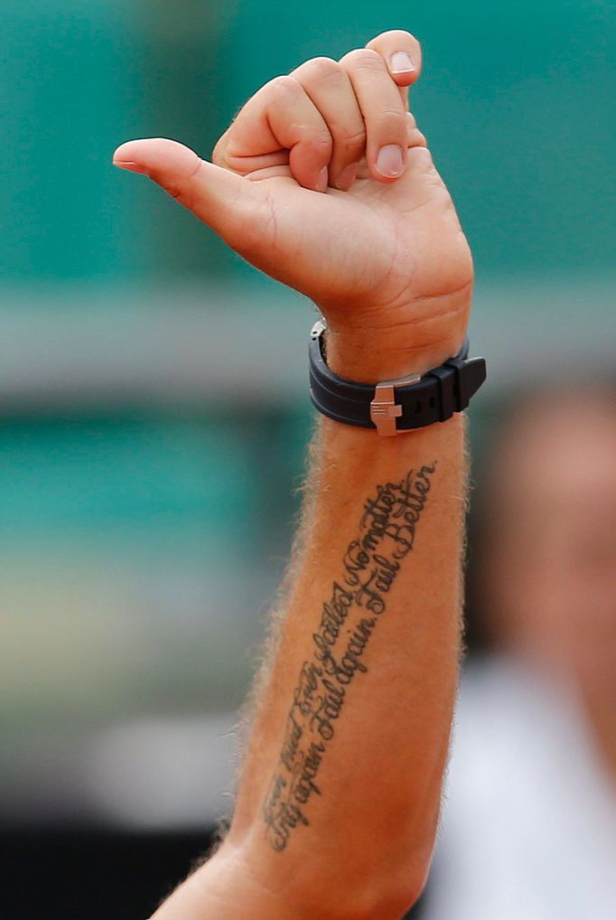 Stan Wawrinka of Switzerland celebrates after defeating Marsel Ilhan of Turkey during their men's singles match at the French Open tennis tournament at the Roland Garros