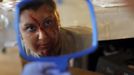 A zombie checks her make-up in a mirror before chasing runners on the "Run for Your Lives" 5K obstacle course race in Amesbury, Massachusetts May 5, 2012. Runners face man-made and natural obstacles on the course, while being chased by zombies, who try to take "health" flags off the runners belts. REUTERS/Brian Snyder (UNITED STATES - Tags: SPORT SOCIETY) Published: Kvě. 5, 2012, 8:15 odp.