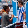Tomas Berdych of Czech Republic shakes hands with Damir Dzumhur of Bosnia and Herzegovina after their men's singles match at the Australian Open 2014 tennis tournament in Melbourne