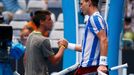 Tomas Berdych of Czech Republic shakes hands with Damir Dzumhur of Bosnia and Herzegovina after their men's singles match at the Australian Open 2014 tennis tournament in