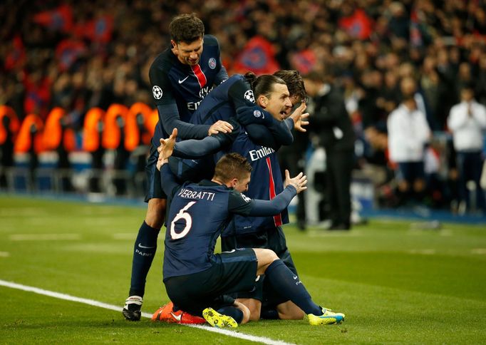 Zlatan Ibrahimovic celebrates with team mates after scoring the first goal for Paris St Germain