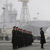 Russian sailors stand in formation in front of the Mistral-class helicopter carrier Vladivostok at the STX Les Chantiers de l'Atlantique shipyard site in Saint-Nazaire