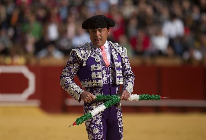 Spanish banderillero Manuel J. Contreras prepares to drive banderillas into a bullfight in Seville