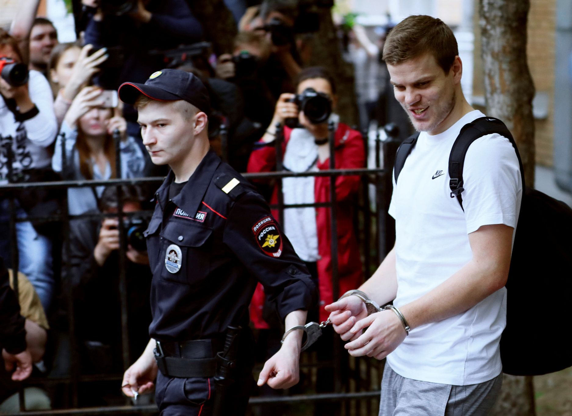Russian soccer player Alexander Kokorin leaves a court after being sentenced to jail for assault, in Moscow