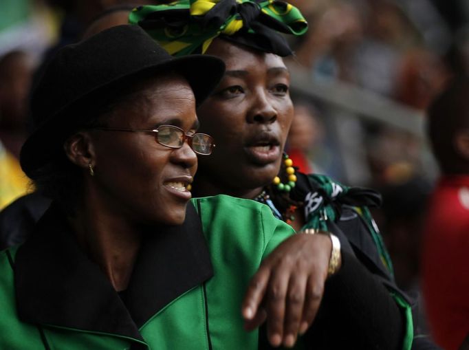 Women dance during the national memorial service