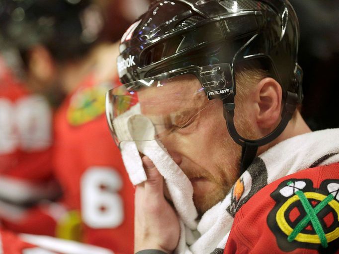 Chicago Blackhawks Marian Hossa (81) cools off at the bench during overtime against the Boston Bruins in Game 2 of their NHL Stanley Cup Finals hockey series in Chicago,