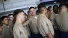 U.S. Marines prepare to line up and stand at the rails of the USS Wasp as the amphibious assault ship enters the New York Harbor for Fleet Week May 23, 2012. REUTERS/Keith Bedford (UNITED STATES - Tags: MILITARY SOCIETY MARITIME) Published: Kvě. 23, 2012, 7:36 odp.