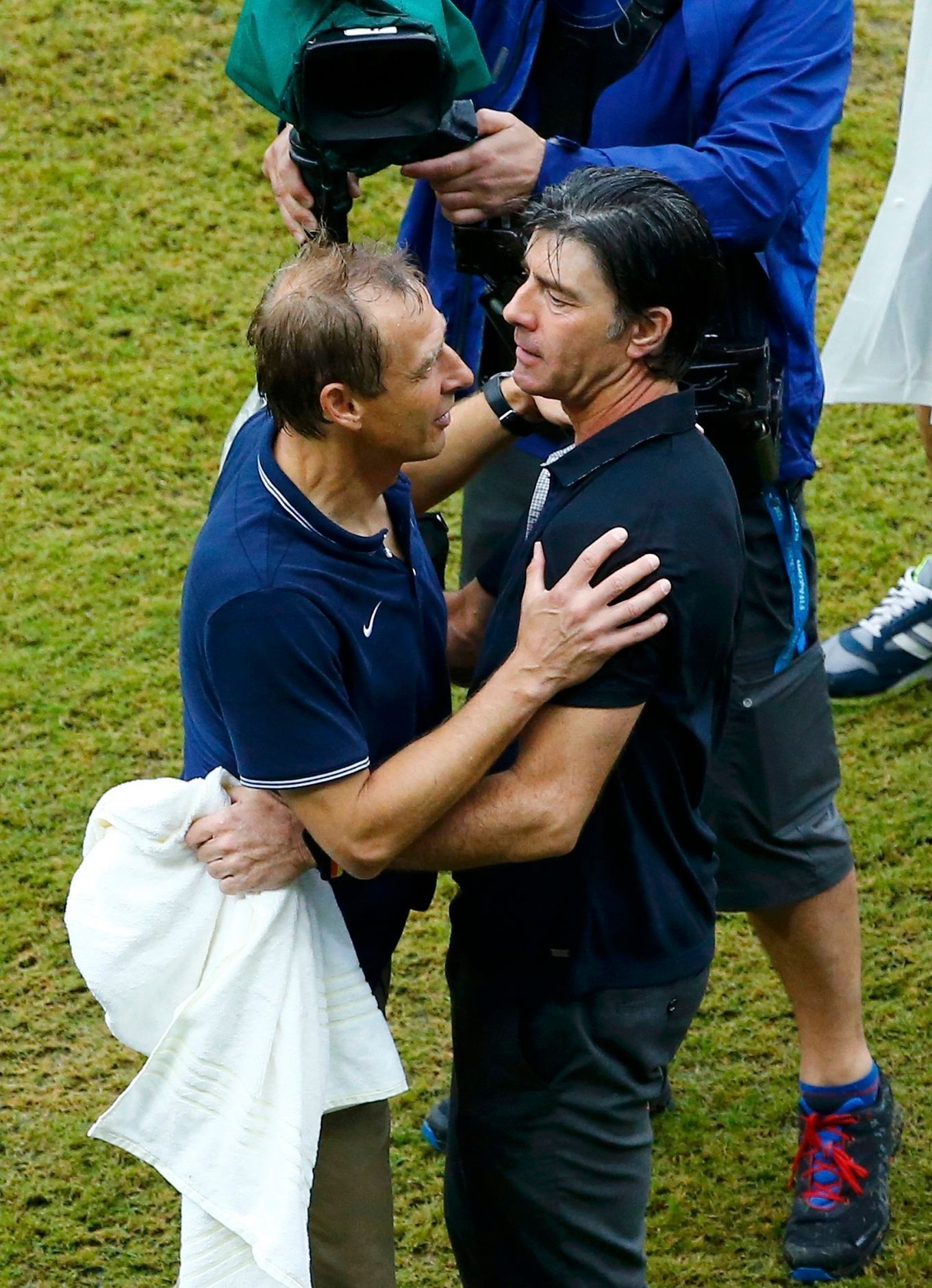 U.S. coach Klinsmann hugs Germany's coach Loew after their teams' 2014 World Cup Group G soccer match in Recife
