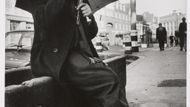 Markéta Luskačová: Man playing mouthorgan in front of Christ Church, Commercial Road, London, 1978