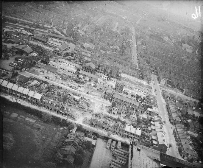 Bomb Damage in London, England, April 1945 Aerial view from the west of the damage resulting from a V2 rocket missile which exploded in the area of Boleyn and Priory Road