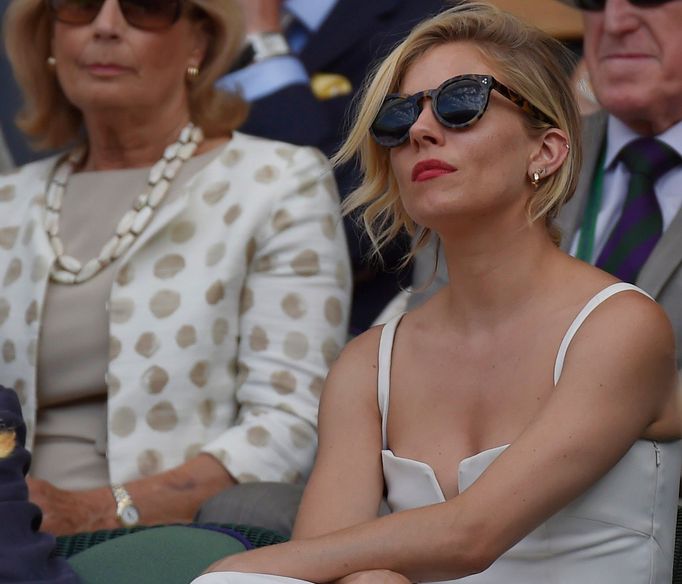 Actor Sienna Miller on Centre Court at the Wimbledon Tennis Championships in London, July 10, 2015. REUTERS/Toby Melville