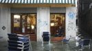 A man rests in a shop in a flooded street during a period of seasonal high water in Venice November 11, 2012. The water level in the canal city rose to 149 cm (59 inches) above normal, according to local monitoring institute Center Weather Warnings and Tides. REUTERS/Manuel Silvestri (ITALY - Tags: ENVIRONMENT SOCIETY) Published: Lis. 11, 2012, 1:57 odp.