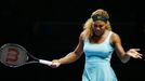 Serena Williams of the U.S. reacts after losing a point to Caroline Wozniacki of Denmark during their WTA Finals singles semi-finals tennis match at the Singapore Indoor