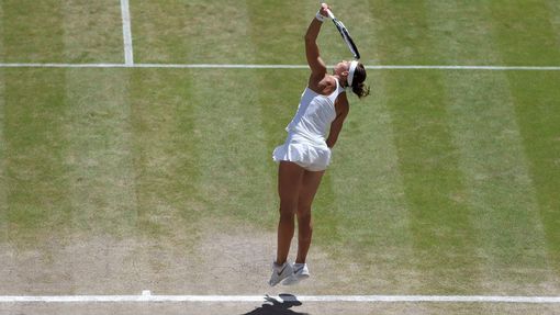 Lucie Safarova of the Czech Republic serves during her women's singles semi-final tennis match against Petra Kvitova of the Czech Republic at the Wimbledon Tennis Champio