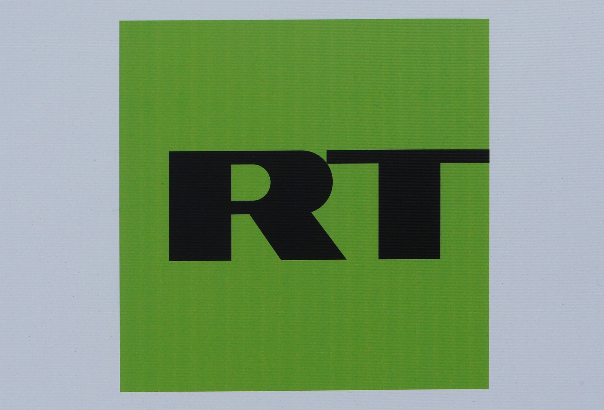 FILE PHOTO: The logo of Russian television network RT is seen on a board at the SPIEF 2017 in St. Petersburg
