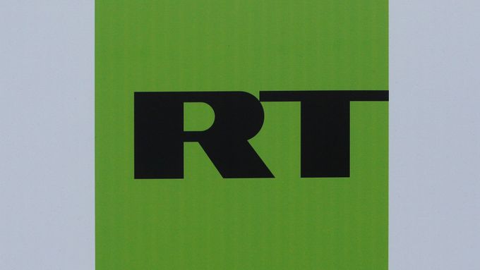 FILE PHOTO: The logo of Russian television network Russia Today (RT) is seen on a board at the St. Petersburg International Economic Forum 2017  in St. Petersburg, Russia