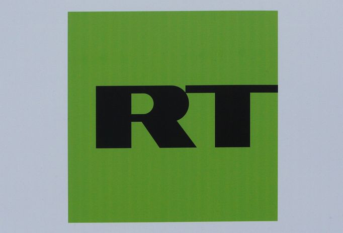 FILE PHOTO: The logo of Russian television network Russia Today (RT) is seen on a board at the St. Petersburg International Economic Forum 2017  in St. Petersburg, Russia