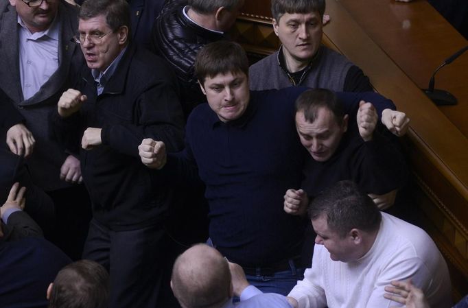 Ukrainan deputies fight during a session of parliament in Kiev February 21, 2014. Fighting broke out between deputies in Ukraine's parliament on Friday when the speaker d