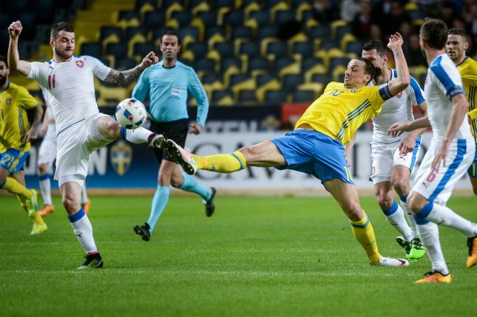 Czech Republic's Daniel Pudil (L) fights for the ball with Sweden's Zlatan Ibrahimovic during the friendly soccer match at the Friends Arena in Stockholm