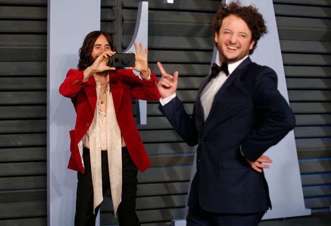 Actor Jared Leto (L) jokes around with a friend.