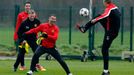 Manchester United's Van Persie, manager Moyes and Giggs laugh as Darren Fletcher jumps for the ball during a training session at the club's Carrington training complex in